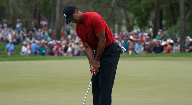 Mar 11, 2018; Palm Harbor, FL, USA; Tiger Woods putts for par on the 18th during the final round of the Valspar Championship golf tournament at Innisbrook Resort - Copperhead Course.