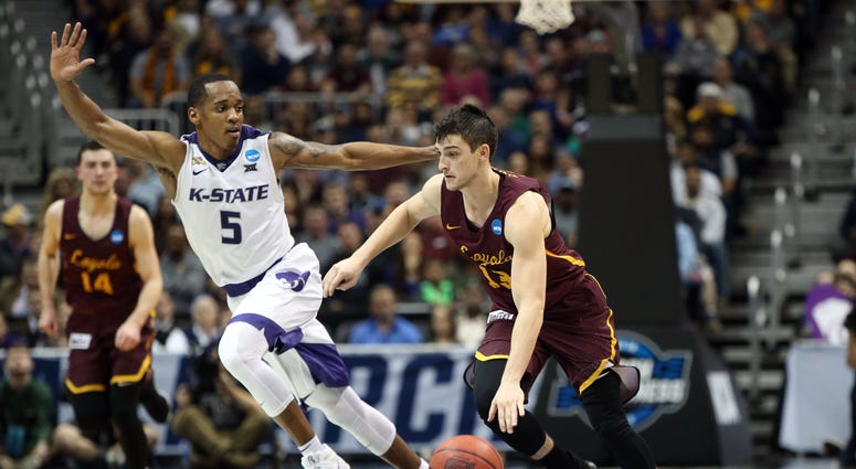 Mar 24, 2018; Atlanta, GA, USA; Loyola Ramblers guard Clayton Custer (13) drives against Kansas State Wildcats guard Barry Brown (5) during the second half in the championship game of the South regional of the 2018 NCAA Tournament at Philips Arena. Loyola Ramblers guard Clayton Custer (13) drives against Kansas State Wildcats guard Barry Brown (5)