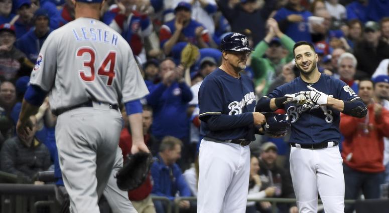 Apr 5, 2018; Milwaukee, WI, USA; Milwaukee Brewers left fielder Ryan Braun (8) smiles at Chicago Cubs pitcher Jon Lester (34) after he was thrown out trying to steal third base in the first inning at Miller Park.