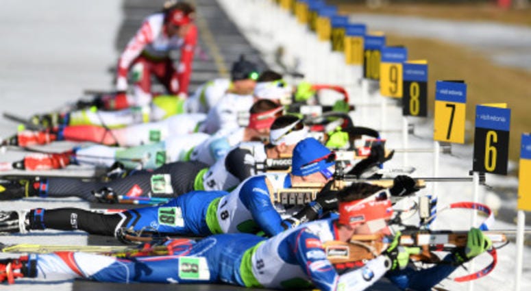 OTEPAA, ESTONIA – MARCH 12, 2017: Biathletes competes during the final single mixed relay of IBU Cup 2016/2017 in Otepaa, Estonia. IBU biathlon Cup final stage was held in Otepaa, Estonia on March 8 – 12, 2017.