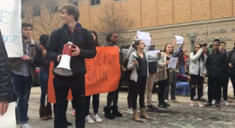 Oak Park & River Forest High School students walk out of class Wednesday to demand stricter gun laws.