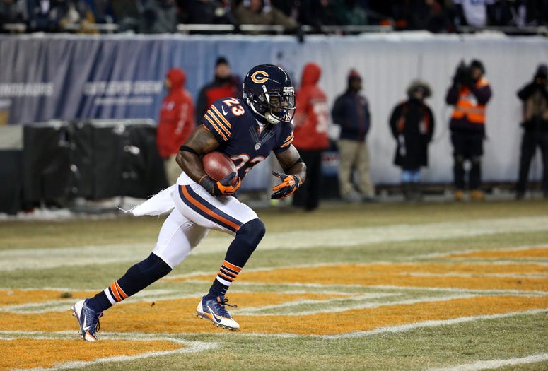 Chicago Bears wide receiver Devin Hester (23) returns the opening kickoff against the Dallas Cowboys at Soldier Field on Monday, Dec. 9, 2013 in Chicago.
