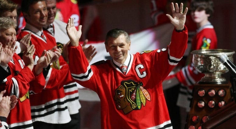 Stan Mikita waves to a full house of fans after being introduced at the United Center during a ceremony honoring former Blackhawks greats Bobby Hull and Stan Mikita on Friday, March 7, 2008, at the United Center in Chicago, Illinois.