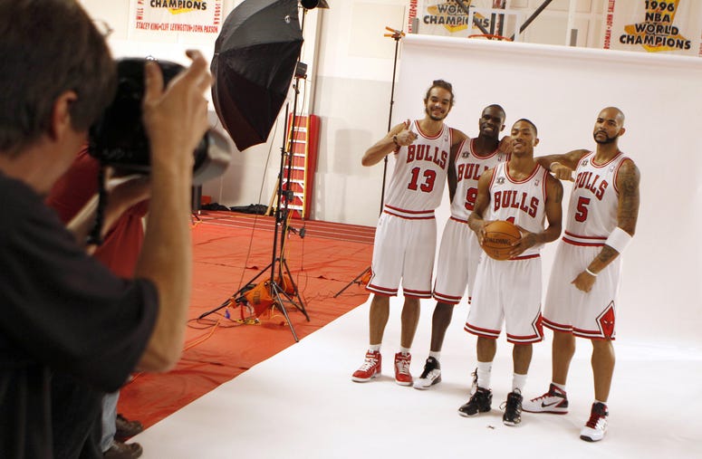 Chicago Bulls players Joakim Noah, from left, Luol Deng, Derrick Rose and Carlos Boozer pose for a photo during media day at the Berto Center in Deerfield, Illinois, Monday, September 27, 2010.