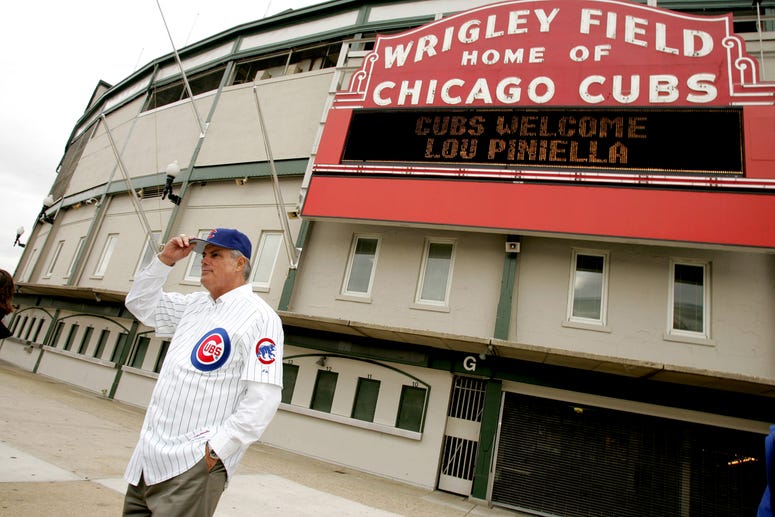 Chicago Cubs new manager Lou Piniella poses for photos in front of the Wrigley Field marquee in Chicago, Illinois, Tuesday, October 17, 2006.