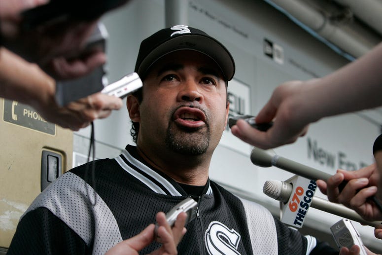 Chicago White Sox manager Ozzie Guillen speaks with reporter
