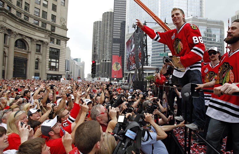 The Chicago Blackhawks' Patrick Kane (88) plays to the crowd during the Blackhawks Stanley Cup Victory Rally at Wacker and Michigan Ave. in Chicago, Illinois, Friday, June 11, 2010.