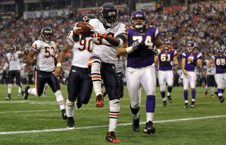 Chicago Bears cornerback Charles Tillman (33) scores a touchdown on an interception in the second quarter against the Minnesota Vikings at the Metrodome in Minneapolis, Minnesota, on Sunday, January 1, 2012