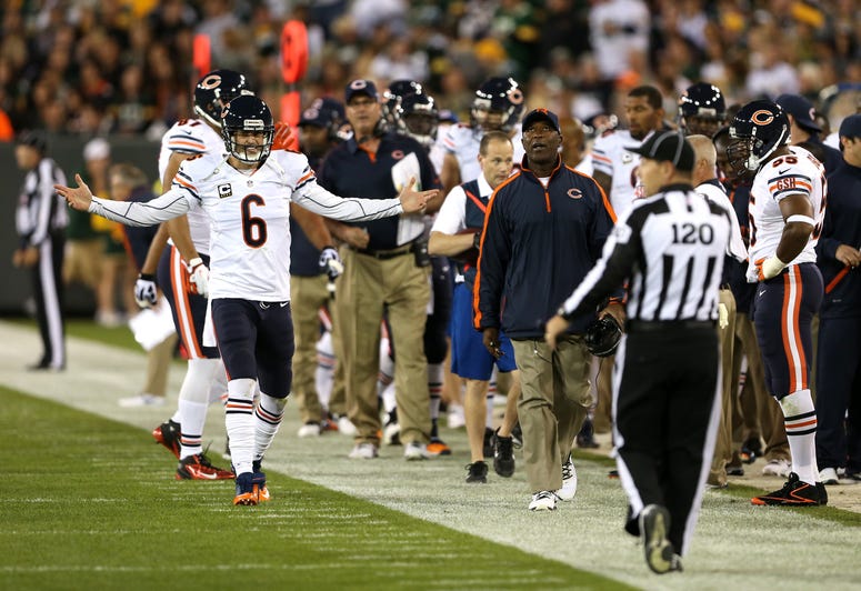 Chicago Bears quarterback Jay Cutler (6) and head coach Lovie Smith argue a call in the first quarter against the Green Bay Packers at Lambeau Field in Green Bay, Wisconsin, Thursday, September 13, 2012.