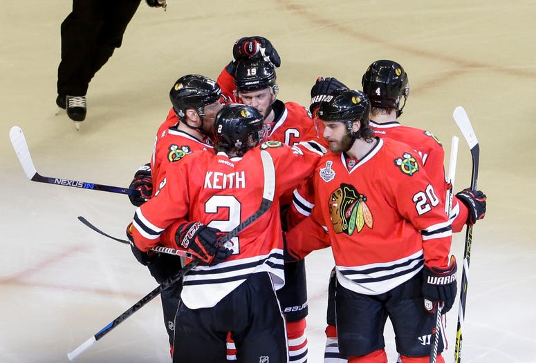 Chicago Blackhawks left wing Brandon Saad (20) and teammates celebrate his goal during the third period of Game 3 of the Stanley Cup Final on Monday, June 8, 2015, at the United Center in Chicago.