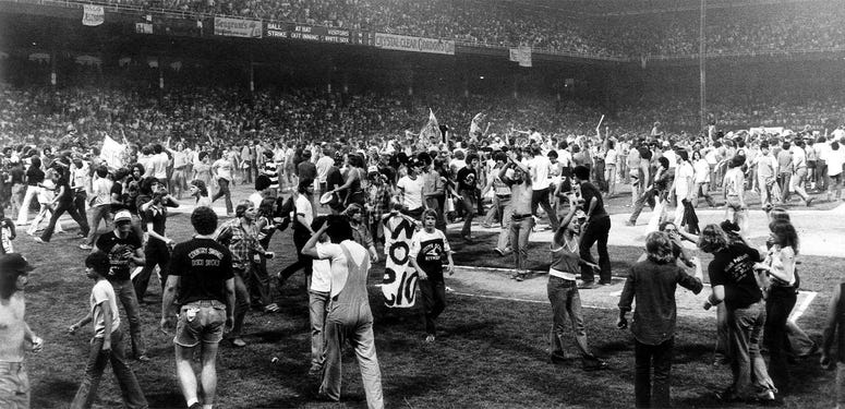 An anti-disco promotion in Comiskey Park in 1979 drew thousands of teens, who poured onto the field between games of a White Sox double-header. The Sox forfeited the second game. An anti-disco promotion in Comiskey Park in 1979 drew thousands of teens, who poured onto the field between games of a White Sox double-header. The Sox forfeited the second game.