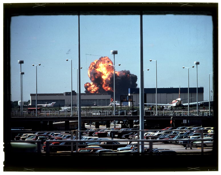 Beneath the smoke lie fragments of the American Airlines Flight 191 jetliner that crashed and exploded on May 25, 1979, shortly after taking off from O'Hare International Airport. All aboard perished. Beneath the smoke lie fragments of the American Airlines Flight 191 jetliner that crashed and exploded on May 25, 1979, shortly after taking off from O'Hare International Airport. All aboard perished.