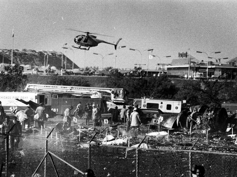 Victims are marked with numbered flags for identification as emergency workers sift through debris from American Airlines Flight 191, which crashed after take off from O'Hare International Airport on May 25, 1979. Victims are marked with numbered flags for identification as emergency workers sift through debris from American Airlines Flight 191, which crashed after take off from O'Hare International Airport on May 25, 1979.