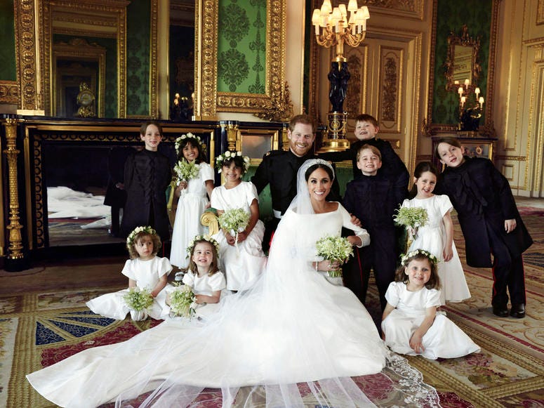 Official wedding photo of Britain's Prince Harry and Meghan Markle, center, in Windsor Castle, Windsor, England, Saturday May 19, 2018.