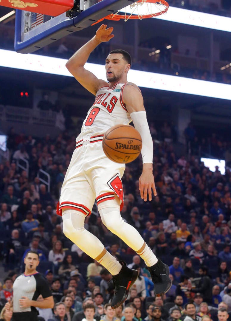 Chicago Bulls guard Zach LaVine dunks against the Golden State Warriors in first half.