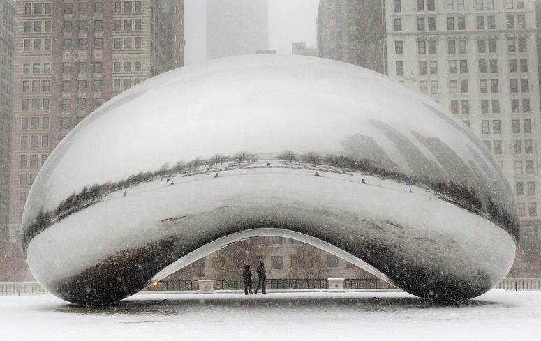 Snow falls on the Cloud Gate sculpture in Millennium Park on February 1, 2011 in Chicago Snow falls on the Cloud Gate sculpture in Millennium Park on February 1, 2011 in Chicago