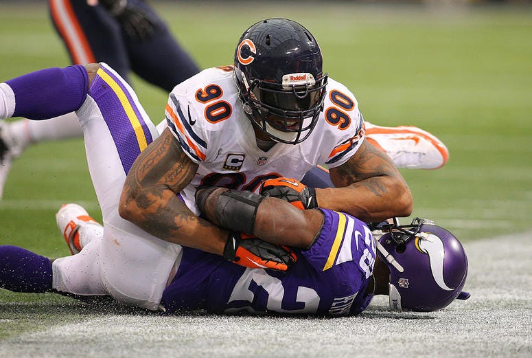 Adrian Peterson #28 of the Minnesota Vikings is tackled by Julius Peppers #90 of the Chicago Bears on December 1, 2013 at Mall of America Field at the Hubert Humphrey Metrodome in Minneapolis, Minnesota. Adrian Peterson #28 of the Minnesota Vikings is tackled by Julius Peppers #90 of the Chicago Bears on December 1, 2013 at Mall of America Field at the Hubert Humphrey Metrodome in Minneapolis, Minnesota.