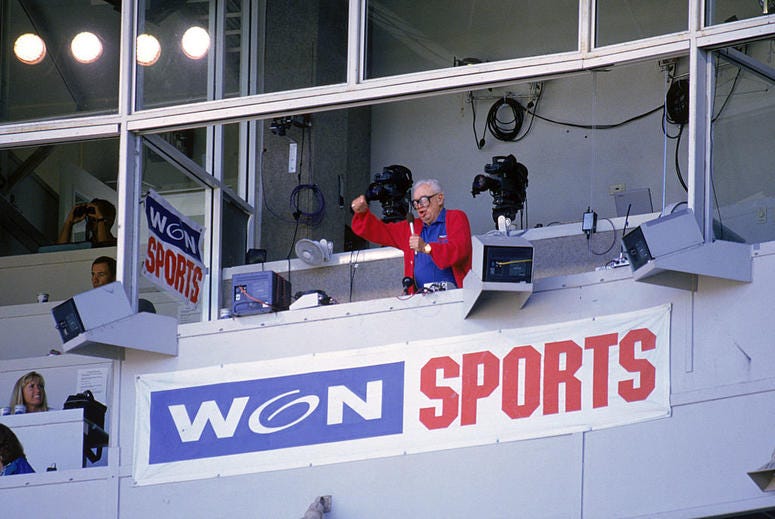 Chicago Cubs baseball announcer and Baseball Hall of Fame inductee Harry Caray conducts fans singing 'Take Me Out to the Ball Game' from his television booth during the seventh inning stretch in a game against the Colorado Rockies at Wrigley Field Chicago Cubs baseball announcer and Baseball Hall of Fame inductee Harry Caray conducts fans singing 'Take Me Out to the Ball Game' from his television booth during the seventh inning stretch in a game against the Colorado Rockies at Wrigley Field