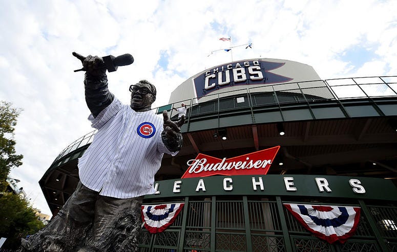 CHICAGO, ILLINOIS - OCTOBER 07: A statue of Harry Caray stands in front of Wrigley Field before the game between the Chicago Cubs and the San Francisco Giants on October 7, 2016 in Chicago, Illinois. CHICAGO, ILLINOIS - OCTOBER 07: A statue of Harry Caray stands in front of Wrigley Field before the game between the Chicago Cubs and the San Francisco Giants on October 7, 2016 in Chicago, Illinois.