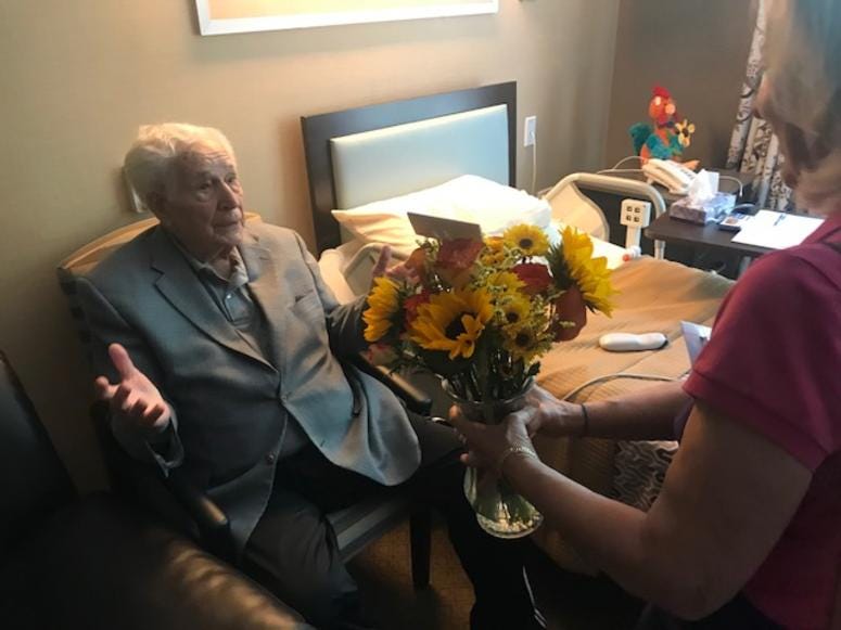 The organization serves about 500 people a week, and just delivered its 100,000th bouquet, a milestone marked by another smile.
