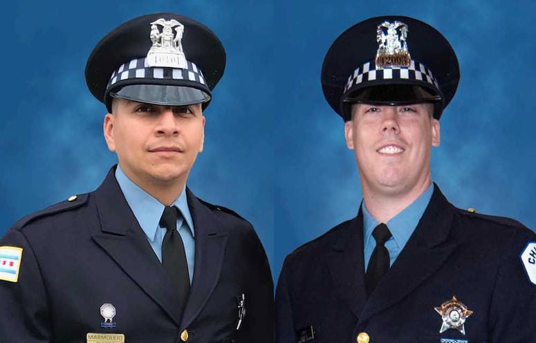 Officer Eduardo Marmolejo (left) and Officer Conrad Gary