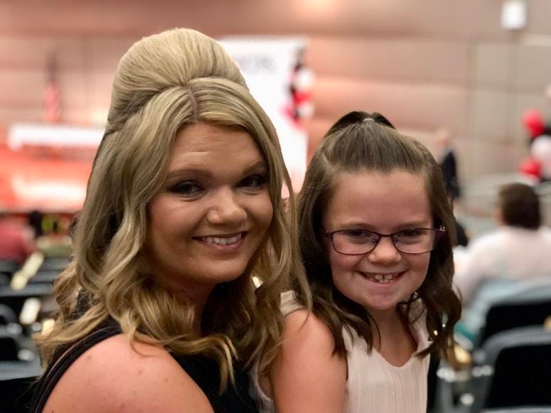 Karen Cook and her daughter Braylynn attend the DCFS scholarship ceremony Friday, July 27, at the Thompson Center. Karen Cook and her daughter Braylynn attend the DCFS scholarship ceremony Friday, July 27, at the Thompson Center.
