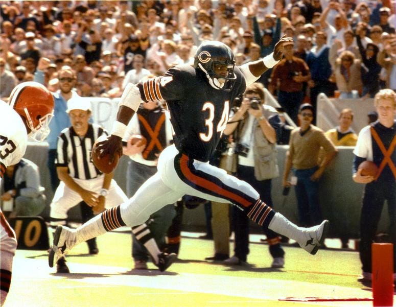 Walter Payton strides into the end zone during a game against the Cleveland Browns in 1986. Walter Payton strides into the end zone during a game against the Cleveland Browns in 1986.