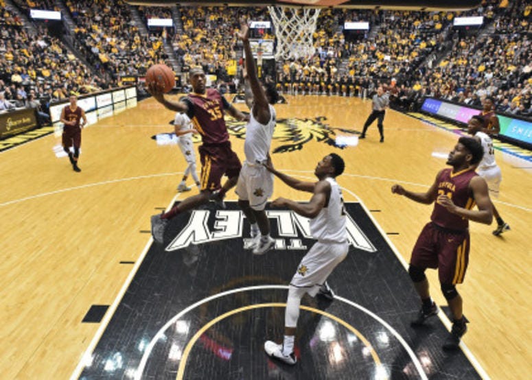 Jan 11, 2017; Wichita, KS, USA; Loyola-Chicago Ramblers guard Milton Doyle (35) drives to the basket against the Wichita State Shockers during the first half at Charles Koch Arena.