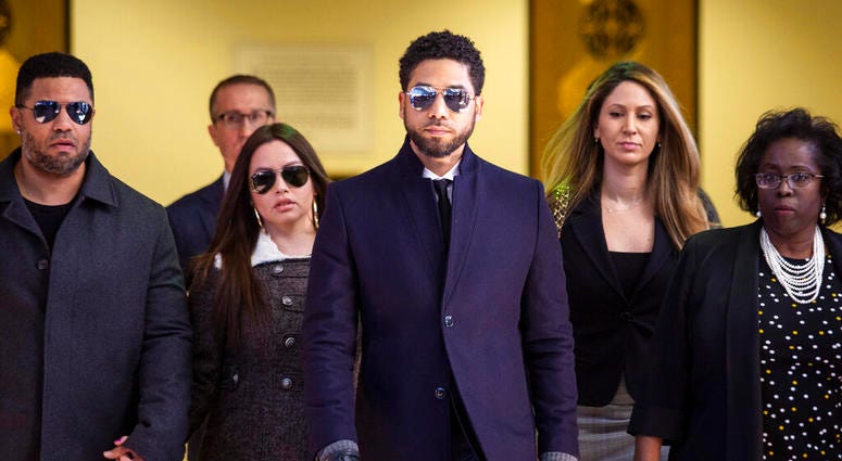 Actor Jussie Smollett, center, leaves the Leighton Criminal Courthouse in Chicago after prosecutors dropped all charges against him on Tuesday, March 26, 2019 Actor Jussie Smollett, center, leaves the Leighton Criminal Courthouse in Chicago after prosecutors dropped all charges against him on Tuesday, March 26, 2019