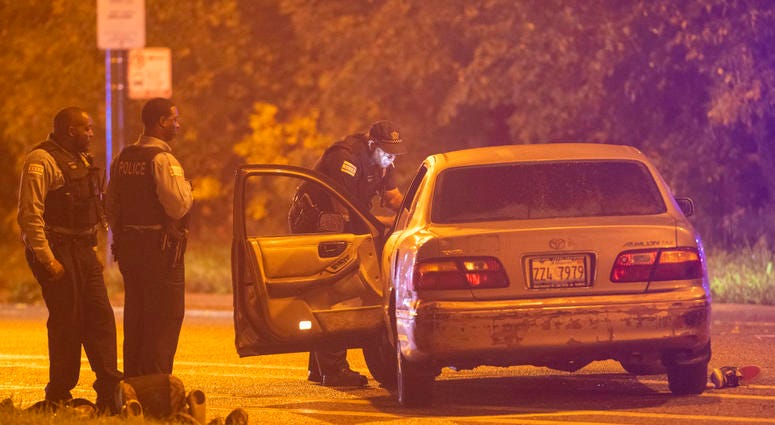Chicago police investigate a scene where three people where shot Monday morning in the 11200 block of South Cottage Grove Ave. The initial scene happened near a McDonalds at the 600 block of East 115th Street.