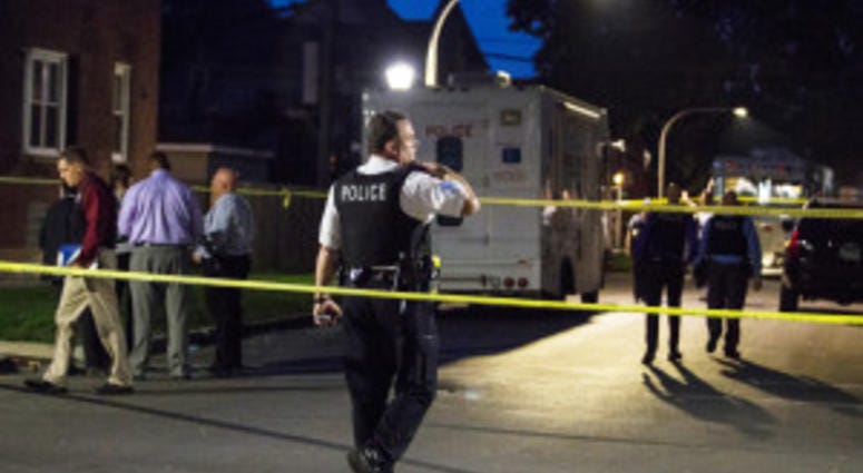 Chicago Police investigate in the 5200 block of West Ohio, where an officer shot a man during an "armed encounter" early Saturday, May 26, 2018. | Chicago Police investigate in the 5200 block of West Ohio, where an officer shot a man during an "armed encounter" early Saturday, May 26, 2018. | Ashlee Rezin/Sun-Times