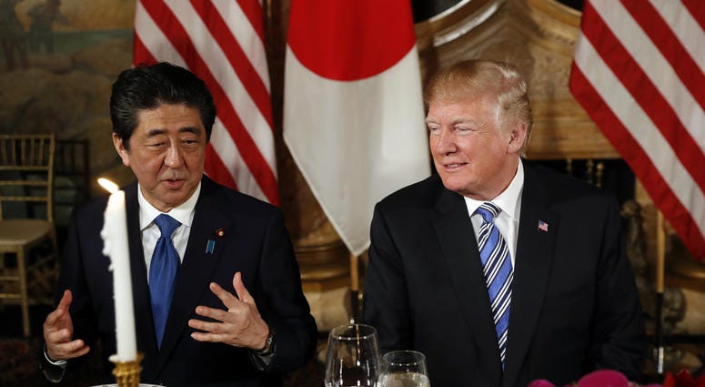 President Donald Trump talks with Japanese Prime Minister Shinzo Abe before dinner at Trump's private Mar-a-Lago club, Wednesday, April 18, 2018, in Palm Beach, Fla. Donald Trump Russia Sanctions
