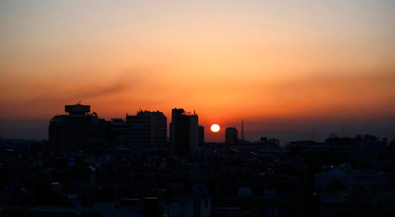 Smoke rises at sunrise after airstrikes targeting different parts of the Syrian capital Smoke rises at sunrise after airstrikes targeting different parts of the Syrian capital Damascus, early Saturday, April 14, 2018. Syria's capital has been rocked by loud explosions that lit up the sky with heavy smoke.