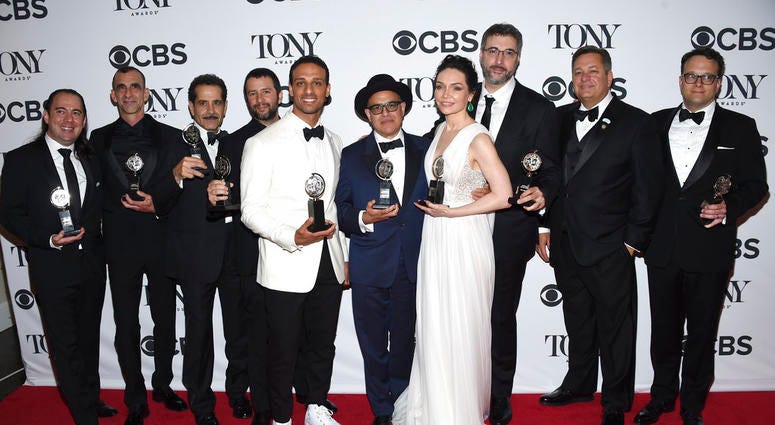 Cast and crew of "The Band's Visit" pose in the press room with the award for best musical at the 72nd annual Tony Awards at Radio City Music Hall on Sunday, June 10, 2018, in New York.