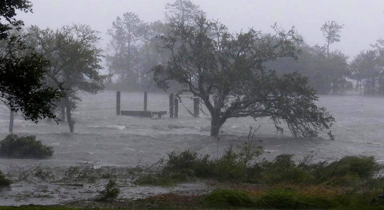 High winds and storm surge from Hurricane Florence hits Swansboro N.C., Friday, Sept. 14, 2018. (AP Photo/Tom Copeland) High winds and storm surge from Hurricane Florence hits Swansboro N.C., Friday, Sept. 14, 2018. (AP Photo/Tom Copeland)