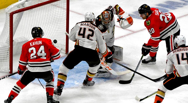 Chicago Blackhawks left wing Brandon Saad (20) scores a goal against Anaheim Ducks goaltender John Gibson (36) and defenseman Josh Manson (42) as center Dominik Kahun (24) looks on during the first period of an NHL hockey game on Tuesday Oct. 23, 2018, in Chicago Blackhawks left wing Brandon Saad (20) scores a goal against Anaheim Ducks goaltender John Gibson (36) and defenseman Josh Manson (42) as center Dominik Kahun (24) looks on during the first period of an NHL hockey game on Tuesday Oct. 23, 2018, in