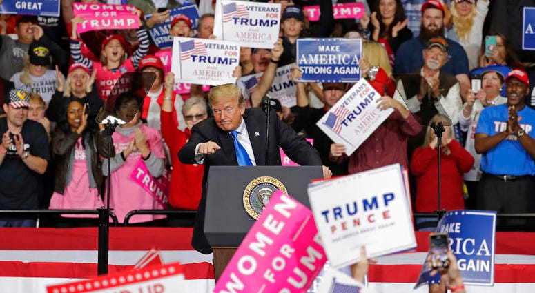 President Donald Trump gestures to the crowd during a campaign rally in Charlotte, N.C., Friday, Oct. 26, 2018. (AP Photo/Chuck Burton) President Donald Trump gestures to the crowd during a campaign rally in Charlotte, N.C., Friday, Oct. 26, 2018. (AP Photo/Chuck Burton)