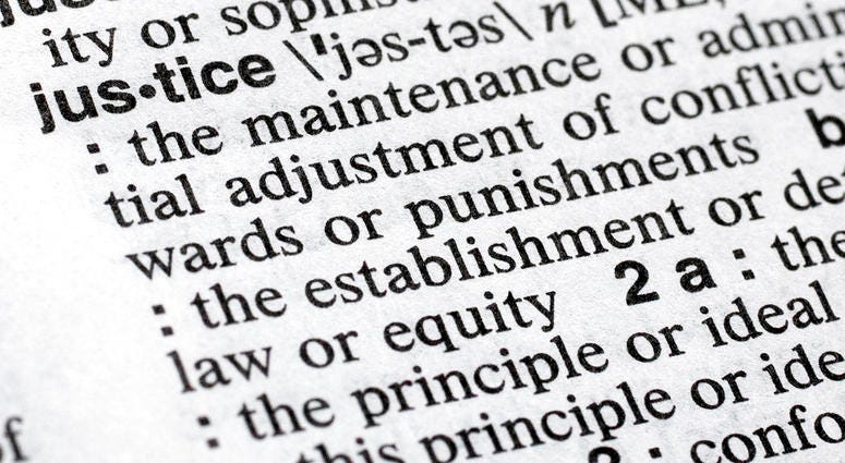 In this Dec. 12, 2018, photo, "justice" is displayed in a Merriam-Webster dictionary in New York. Merriam-Webster has chosen "justice" as its 2018 word of the year, driven by the churning news cycle and President Trump's Twitter feed.