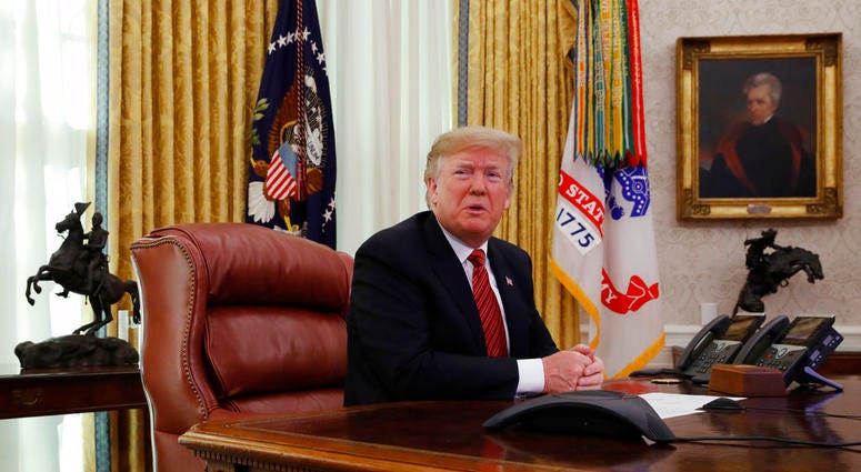President Donald Trump answers questions from the media after speaking with members of the military by video conference on Christmas Day, Tuesday, Dec. 25, 2018, in the Oval Office of the White House. (AP Photo/Jacquelyn Martin) President Donald Trump answers questions from the media after speaking with members of the military by video conference on Christmas Day, Tuesday, Dec. 25, 2018, in the Oval Office of the White House. (AP Photo/Jacquelyn Martin)