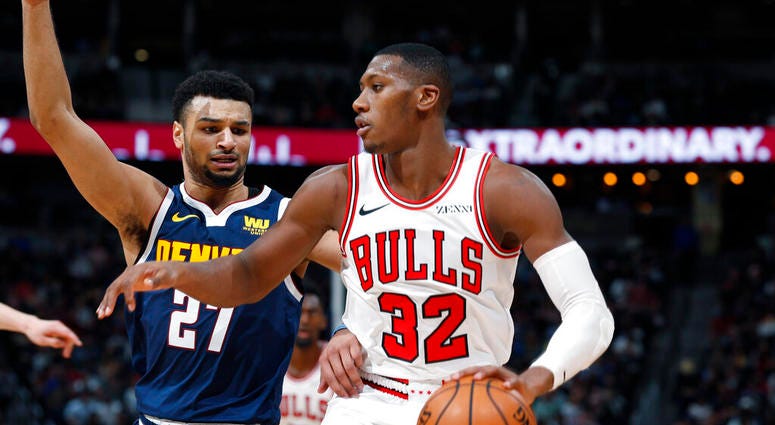 Chicago Bulls guard Kris Dunn (32) works against Denver Nuggets guard Jamal Murray (27) in the second half of an NBA basketball game, Thursday, Jan. 17, 2019, in Denver. The Nuggets won 135-105.