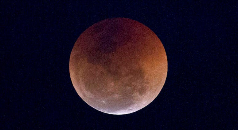 FILE - This Friday, July 27, 2018 file photo shows a blood moon lunar eclipse from the Arpoador beach in Rio de Janeiro, Brazil. Starting Sunday evening, Jan. 20, 2019, all of North and South America will be able to see the only total lunar eclipse of 201 FILE - This Friday, July 27, 2018 file photo shows a blood moon lunar eclipse from the Arpoador beach in Rio de Janeiro, Brazil. Starting Sunday evening, Jan. 20, 2019, all of North and South America will be able to see the only total lunar eclipse of 201