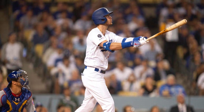 Los Angeles Dodgers' Cody Bellinger watches his two-run home run during the fourth inning of a baseball game against the Chicago Cubs in Los Angeles, Thursday, June 13, 2019. Los Angeles Dodgers' Cody Bellinger watches his two-run home run during the fourth inning of a baseball game against the Chicago Cubs in Los Angeles, Thursday, June 13, 2019.