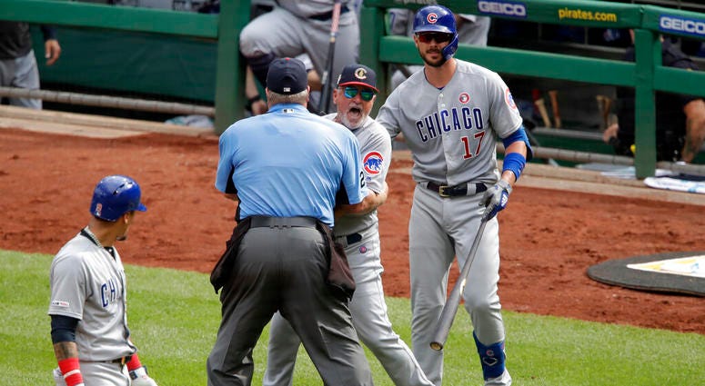 Chicago Cubs manager Joe Maddon, center, yells toward the Pittsburgh Pirates dugout as he is restrained by umpire Joe West and Cubs' Kris Bryant (17) during the fourth inning of a baseball game in Pittsburgh, Thursday, July 4, 2019. Maddon was ejected. Chicago Cubs manager Joe Maddon, center, yells toward the Pittsburgh Pirates dugout as he is restrained by umpire Joe West and Cubs' Kris Bryant (17) during the fourth inning of a baseball game in Pittsburgh, Thursday, July 4, 2019. Maddon was ejected.