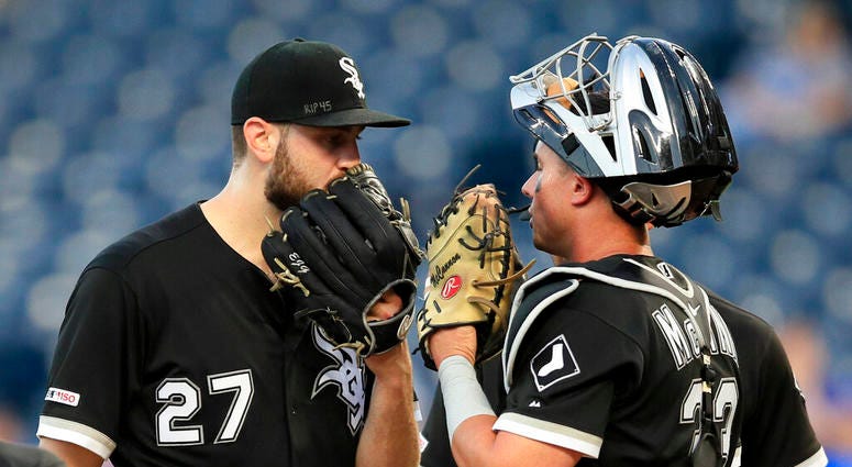 Chicago White Sox starting pitcher Lucas Giolito (27) talks with catcher James McCann (33) after a run scored in the fourth inning of a baseball game against the Kansas City Royals at Kauffman Stadium in Kansas City, Mo., Monday, July 15, 2019. Chicago White Sox starting pitcher Lucas Giolito (27) talks with catcher James McCann (33) after a run scored in the fourth inning of a baseball game against the Kansas City Royals at Kauffman Stadium in Kansas City, Mo., Monday, July 15, 2019.