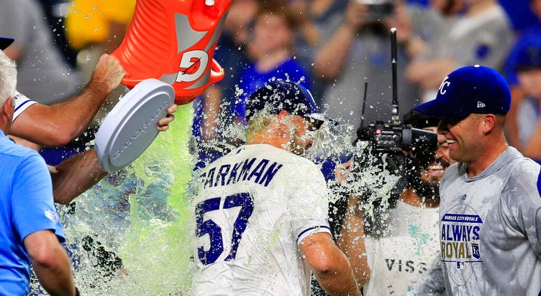 Kansas City Royals starting pitcher Glenn Sparkman (57) is doused by teammate Brian Flynn, left, as Danny Duffy, right, watches following the team's baseball game against the Chicago White Sox at Kauffman Stadium in Kansas City, Mo., Tuesday, July 16 Kansas City Royals starting pitcher Glenn Sparkman (57) is doused by teammate Brian Flynn, left, as Danny Duffy, right, watches following the team's baseball game against the Chicago White Sox at Kauffman Stadium in Kansas City, Mo., Tuesday, July 16.
