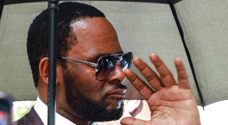 R. Kelly departs from the Leighton Criminal Court building after a status hearing in his criminal sexual abuse trial in Chicago. R. Kelly departs from the Leighton Criminal Court building after a status hearing in his criminal sexual abuse trial in Chicago.