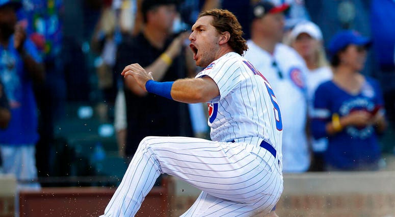 Chicago Cubs' Albert Almora Jr., right, celebrates after scoring a run against the Seattle Mariners during the seventh inning of a baseball game Monday, Sept. 2, 2019, in Chicago. Chicago Cubs' Albert Almora Jr., right, celebrates after scoring a run against the Seattle Mariners during the seventh inning of a baseball game Monday, Sept. 2, 2019, in Chicago.