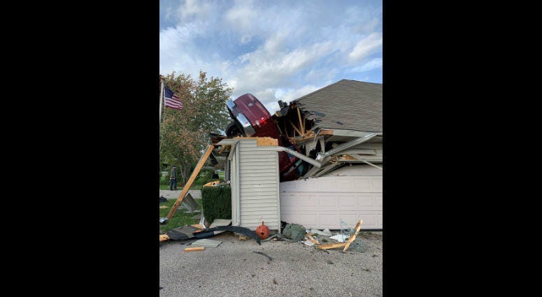 Police say a Wisconsin man was arrested after crashing a pickup truck into the roof of a Beloit home. Police say a Wisconsin man was arrested after crashing a pickup truck into the roof of a Beloit home.