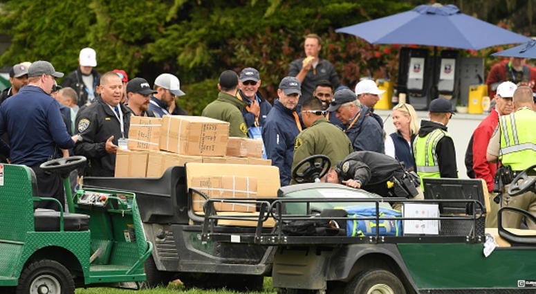 A golf cart loaded with boxes, which was involved an incident, is inspected on the 16th hole during the second round of the 2019 U.S. Open at Pebble Beach Golf Links on June 14, 2019 in Pebble Beach, California. (Photo by Ross Kinnaird/Getty Images) U.S. Open Golf Cart