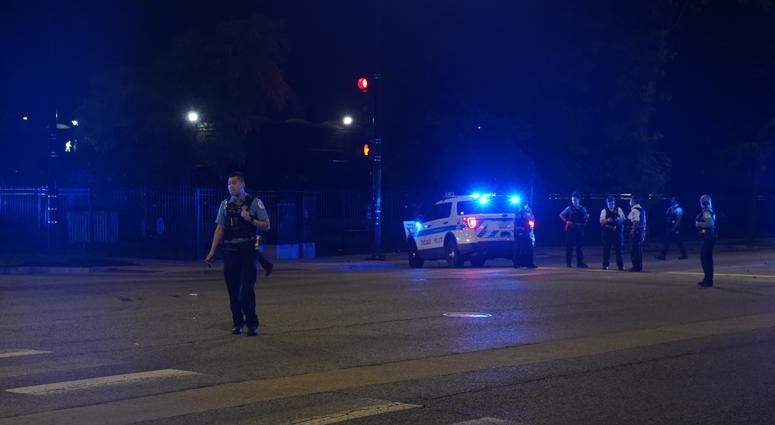Chicago police gather at the intersection of Western Avenue and Fulton Street, where a police vehicle was rear-ended June 25, 2019. Chicago police gather at the intersection of Western Avenue and Fulton Street, where a police vehicle was rear-ended June 25, 2019.